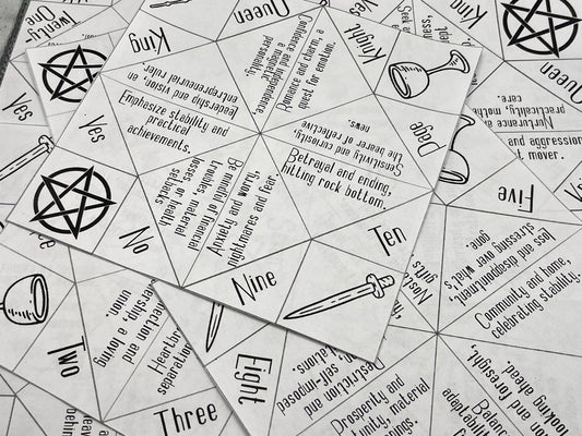 scatter of origami sheets withtarot theme